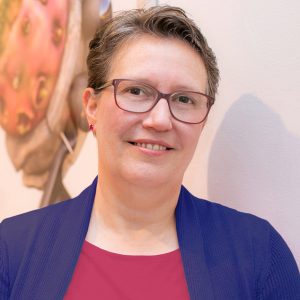 Headshot of instructor Michelle Rothwell, whiet female with short light brown hair and glasses