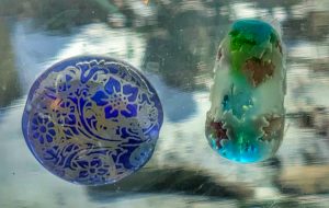 two examples of sandblasted glass beads
